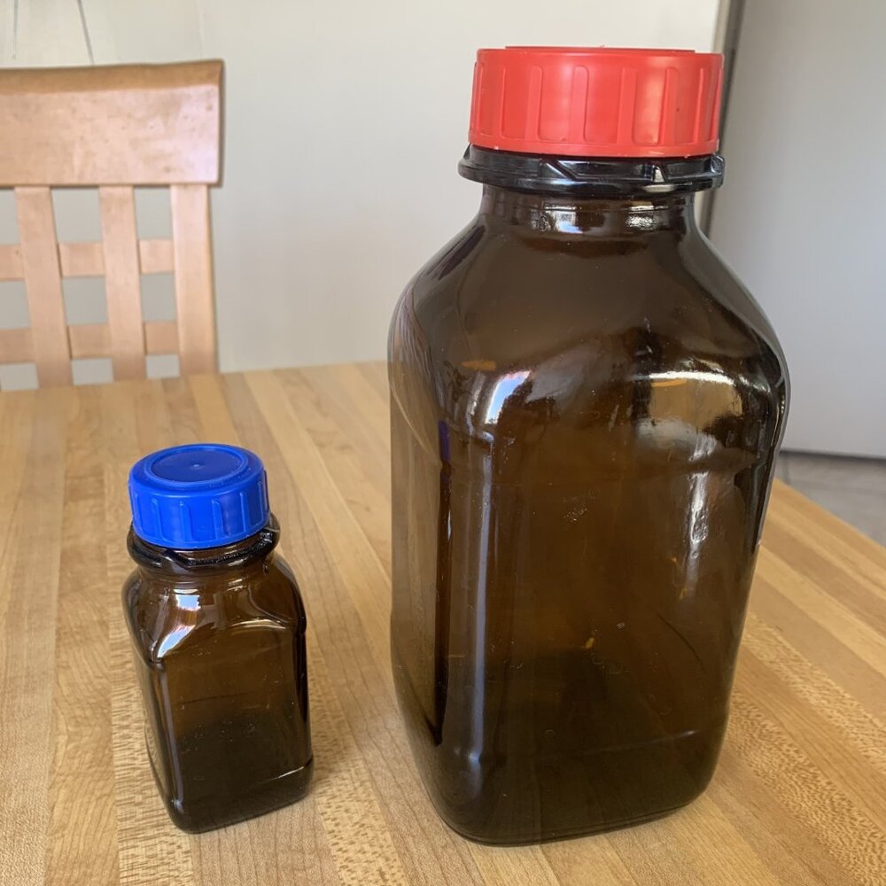 Two  Glass Square Amber Bottles w/ Cap